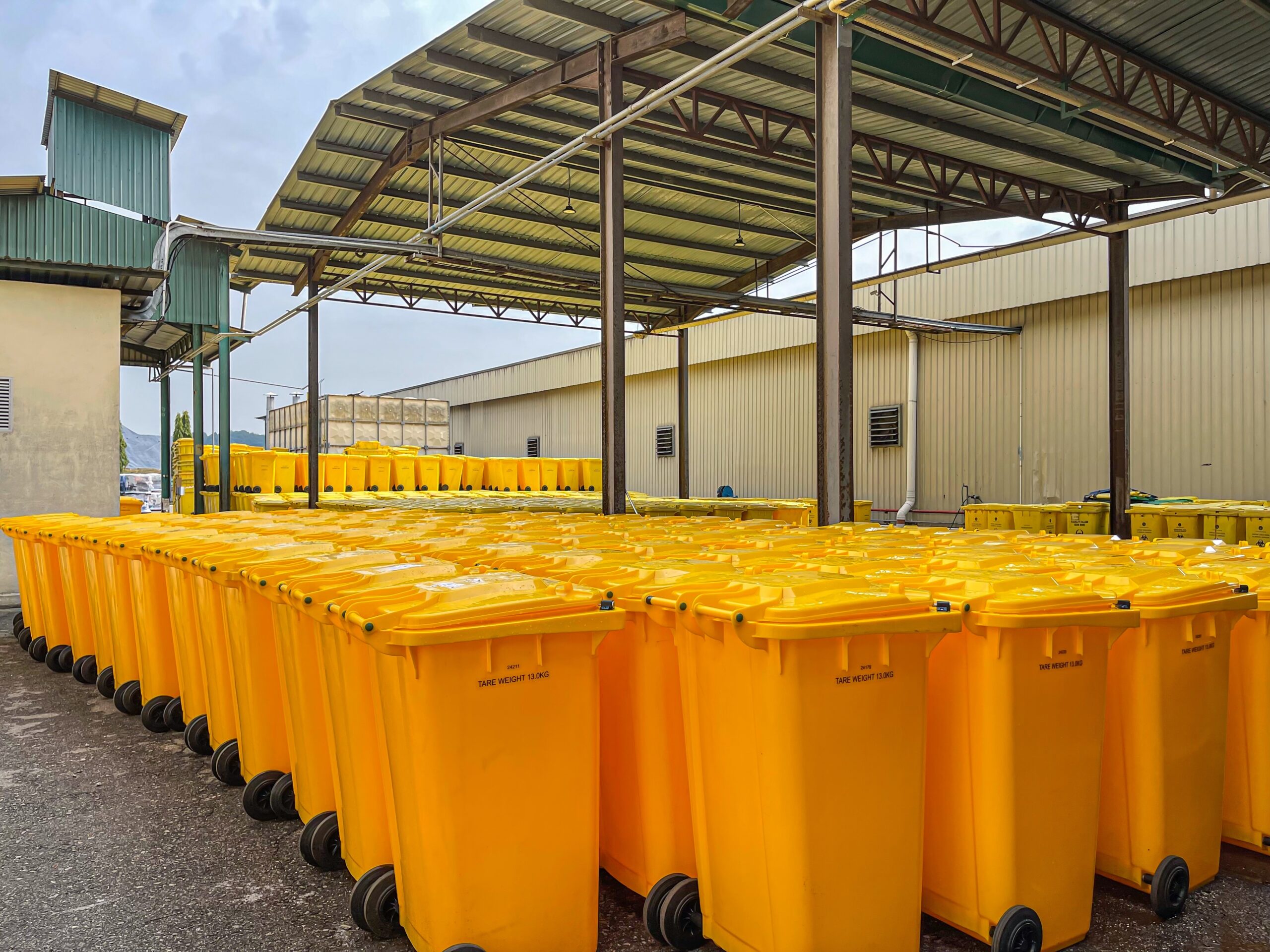 Yellow clinical waste bin in storage